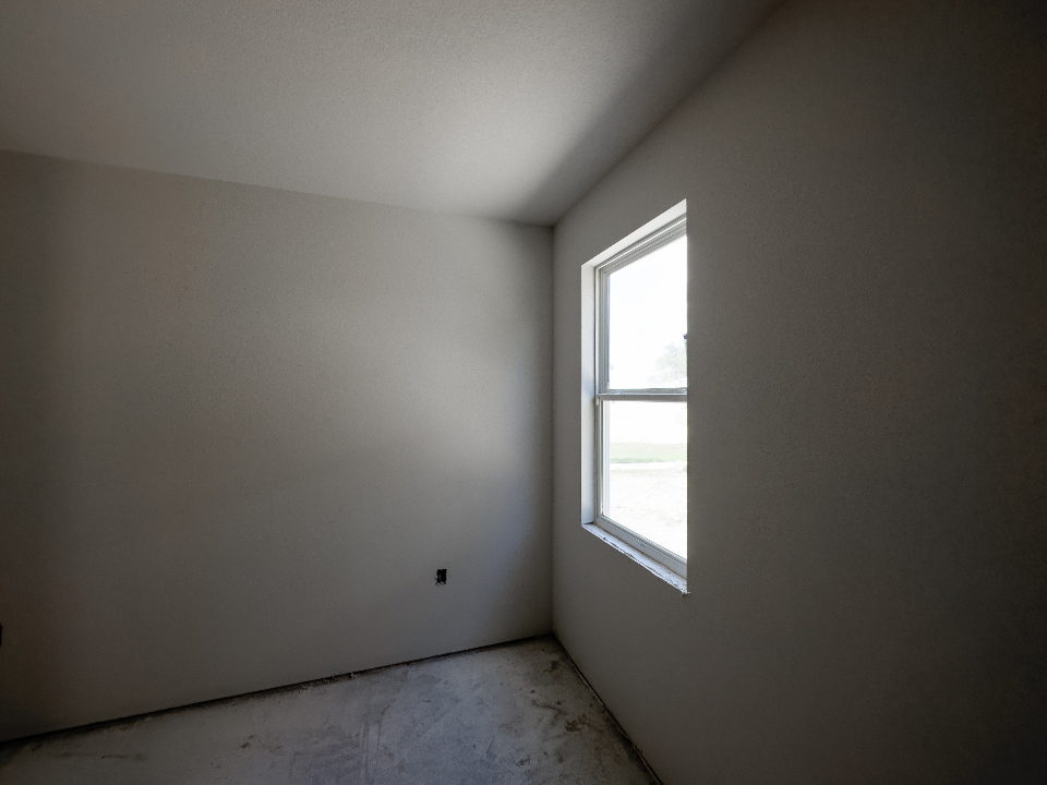 Finished drywall in a bright room